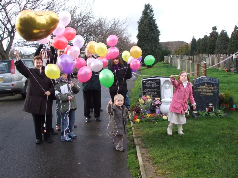 [4th Anniversary at the Cemetery letting off the balloons.JPG]