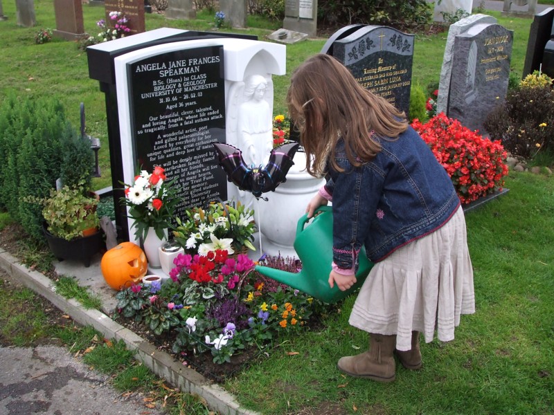 [Millie, Angela's neice watering her flowers.JPG]