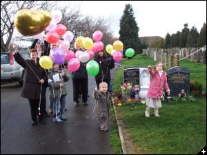 [4th Anniversary at the Cemetery letting off the balloons]