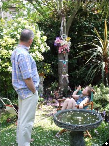 [Mike explaining to granddaughter Millie about 'Angela's Tree']