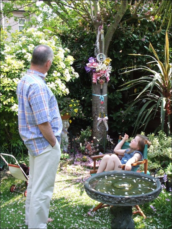 [Mike explaining to granddaughter Millie about 'Angela's Tree'.JPG]